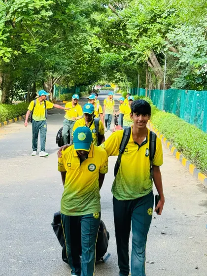 Players arrive for their match in Chennai, carrying their kit bags and ready to compete.