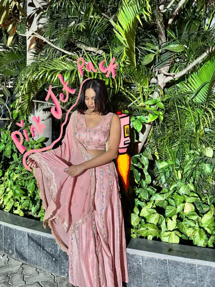 Pink jet pack activated. This pink lehenga gets a fun, futuristic twist with a rocket doodle.