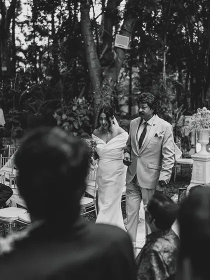A powerful and emotional moment as the father walks his daughter down the aisle. A timeless memory captured in black and white.