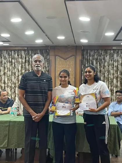 Our silver medalists Vedika Kulkarni and Alka Karaiyal with a senior official during the award ceremony.
