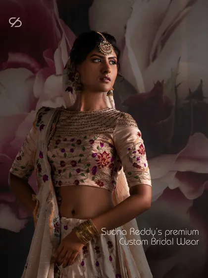 A closer look at the premium custom bridal wear I create. The boat neck blouse is adorned with detailed floral embroidery, designed to complement the grandeur of your wedding day.