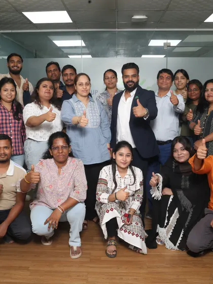 Our team celebrating a successful project. We are a family dedicated to creating beautiful memories for you.