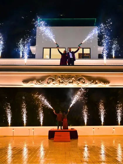 A truly explosive celebration of love. The couple's portrait on the rooftop with a stunning display of cold fireworks created a breathtaking and unforgettable moment at their reception.