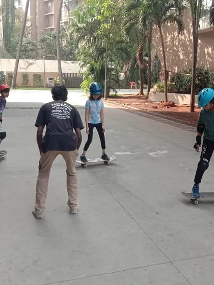 Skateboarding is an amazing skill that builds balance and courage. Here, our coach provides instruction to a small group, ensuring each student gets personalized tips to improve their technique safely.