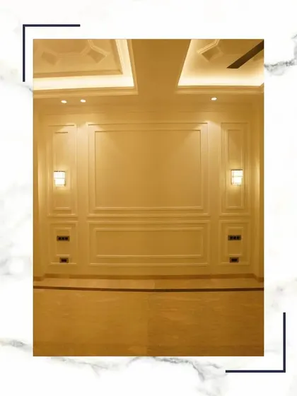 In our homes, luxury isn't an option; it's the standard. This empty living room, with its perfect wall panels and coffered ceiling, is a testament to our commitment to building extraordinary spaces.