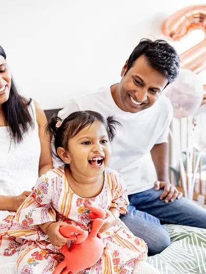 A happy family moment captured in timeless black and white. These candid shots are perfect for showing the laughter and fun of celebrating a second birthday at home.