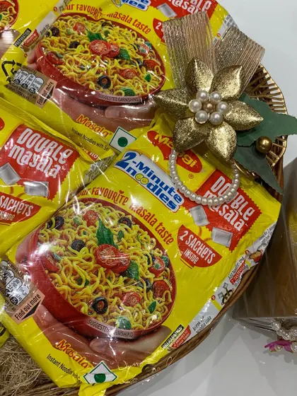 A quirky and fun trousseau packing idea. This basket is filled with Maggi noodle packets, perfect for a bride who loves her comfort food.