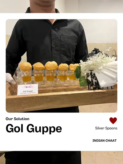 Our Gol Gappe station offers a refined way to enjoy this street food favorite. A server presents crispy puris filled with tangy water, ready for guests to enjoy without the mess.
