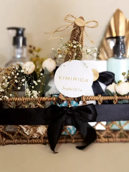 A duplicate image of the dark wicker basket we styled for Kimirica, showcasing the beautiful contrast of black, white, and gold.