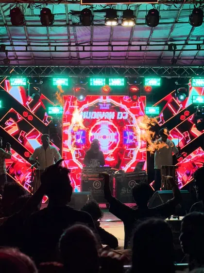 The moment the fire performers join the Chenda fusion set. This combination of sound and pyrotechnics creates a dramatic, high-energy peak during my festival performances.