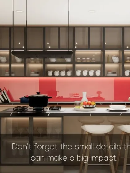 This kitchen makes a bold statement with a red lacquered glass backsplash, paired with neutral cabinets and a functional island.