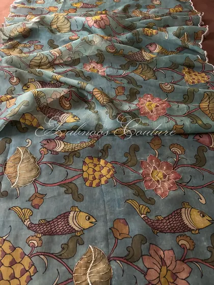 A closer look at the artistry of a pure organza Srikalahasti Kalamkari dupatta. This piece features a captivating aquatic theme, with hand-painted fish and lotus motifs brought to life with delicate, shimmering highlights.