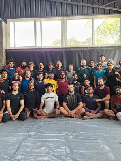 This is our community. A packed mat for the seminar with UFC fighter Dustin Stoltzfus shows the dedication of our students. We foster an environment where everyone is serious about learning and supporting each other's growth.