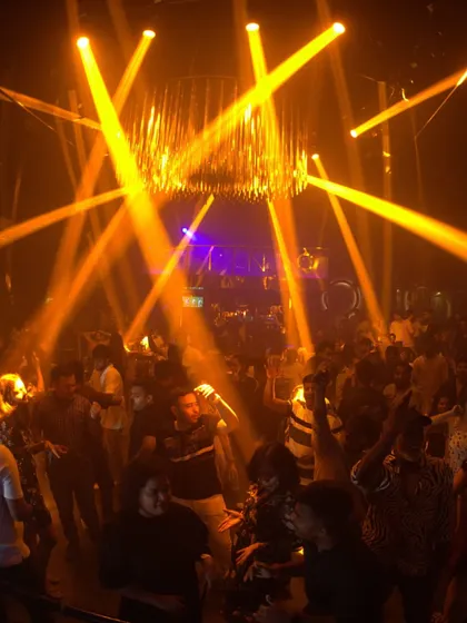 Another perspective of the pure, unfiltered energy at the club. The combination of the chandelier and crisscrossing light beams created an incredible atmosphere.