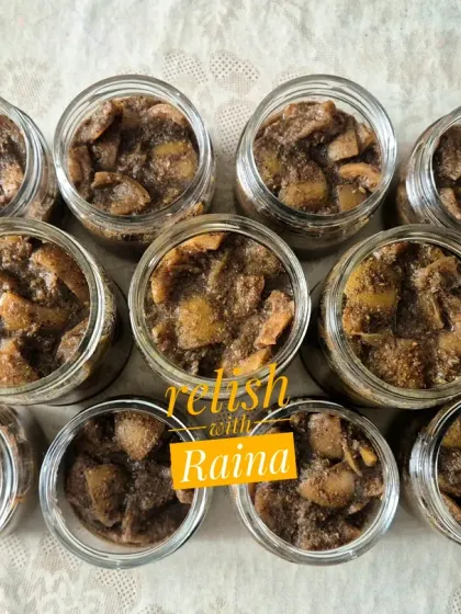 This image shows a freshly made batch of black lemon pickle. Over a few days, the lemons will absorb the dark masala and the colour will deepen significantly. This pickle is known to get better as it ages, sometimes for years.