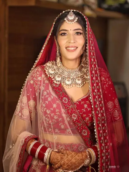 A stunning portrait from Soumya’s wedding. Her makeup is classic and radiant, perfectly suiting her traditional red lehenga.