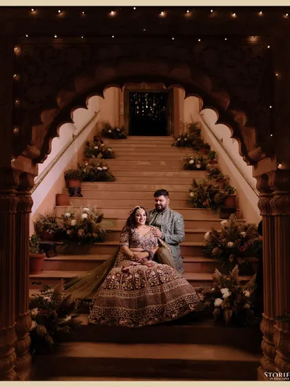 A regal portrait set against the grandeur of a palace staircase. For couples who dream of a majestic celebration, I focus on creating images that reflect that elegance and scale, making you feel like royalty.