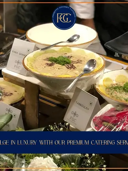 A close-up of our hummus and tabbouleh bowls at a buffet station. The fresh garnishes and clear labeling ensure guests know exactly what they are enjoying.