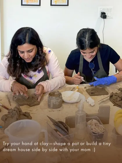 For Mother's Day, we offered special art dates. This image shows a mother and daughter working with clay, a perfect way to connect and create together.