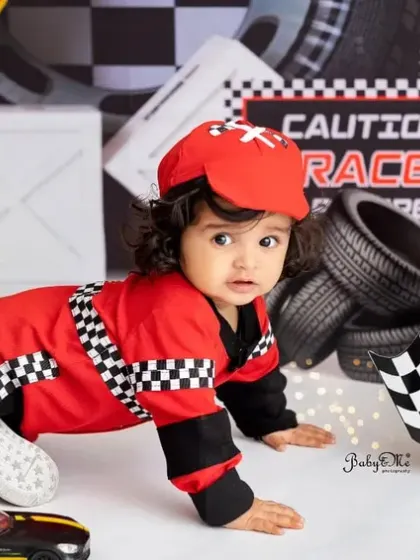 This little racer is on the move. Action shots like this are a great way to show the energy and fun of being a one-year-old.