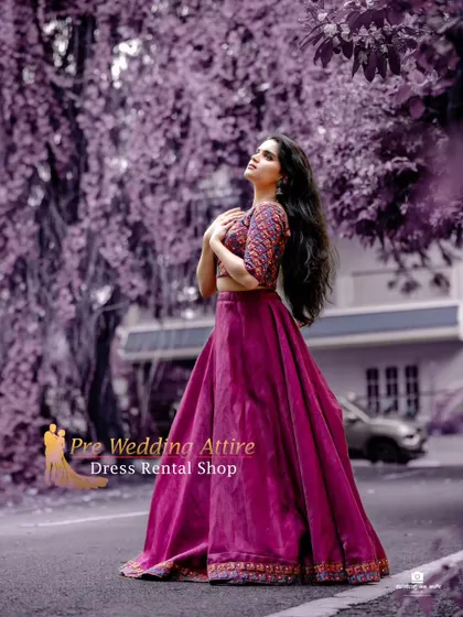A magenta skirt paired with a printed crop top, shot with an artistic purple filter to create a dreamy, surreal effect.