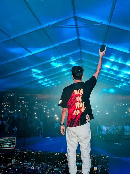 Another angle of me capturing the crowd's energy on my phone.