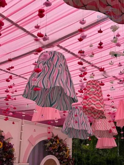 A close-up of the patterned lampshades and hanging floral tassels that adorned the ceiling.