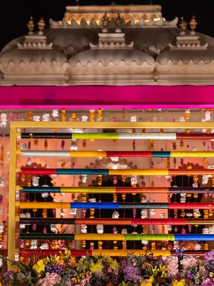 A close-up of the unique bangle backdrop used for a Mehendi ceremony. This creative detail adds a pop of color and a touch of Indian tradition to the decor.