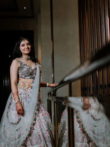 A beautiful portrait of the bride with her reflection visible in the railing.