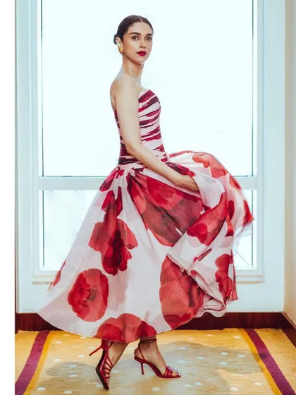 The beautiful movement of the Gauri & Nainika gown. The full organza skirt with bold floral prints is so romantic and dramatic.