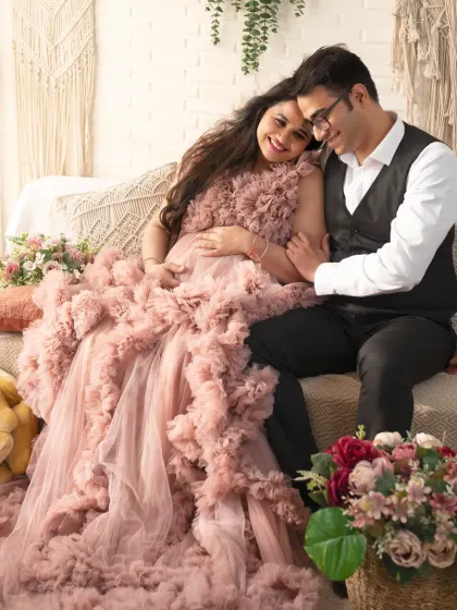 Another beautiful shot from our boho set. The dad-to-be's tender embrace and the mom's serene expression make this a truly heartfelt portrait.