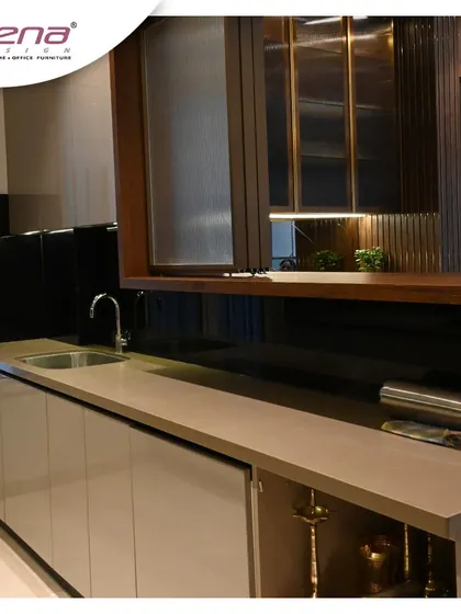 This kitchen features a pass-through window with a lift-up cabinet door, connecting it to the dining area. The black glass backsplash is easy to clean and adds a touch of sophistication.