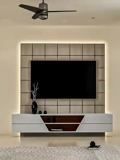 A minimalist floating TV console in white and wood. The design is complemented by a tiled back panel and subtle backlighting, creating a clean and sophisticated focal point in the living room.