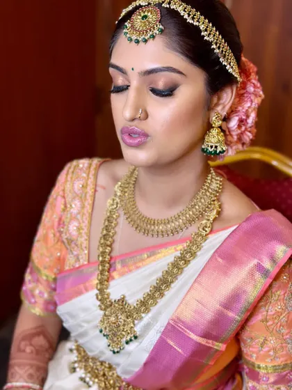 A soft and romantic look for bride Madhurima, with a focus on luminous skin and a pretty pink lip.
