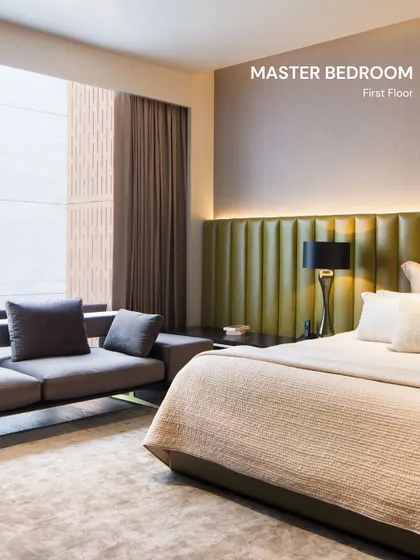 A bedroom should be a personal retreat, a space for rest and rejuvenation. In this master suite, we used a soft, olive green headboard and layered, ambient lighting to create a serene and calming atmosphere. The design prioritizes comfort and tranquility, providing a true escape from the outside world.