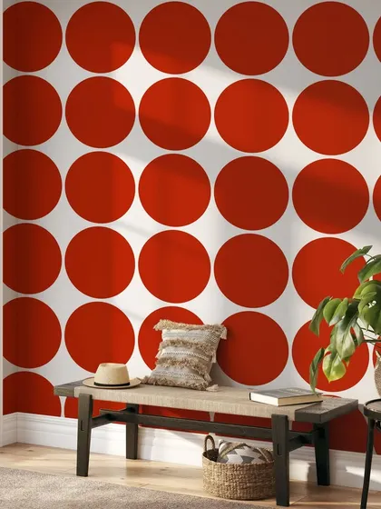 This entryway is transformed by our Symmetric Circles wallpaper in a bold red. The repeating pattern creates a vibrant and energetic atmosphere, making a strong design statement.
