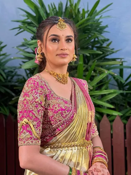 A close up of the engagement look. The makeup is soft and romantic, with a focus on rosy cheeks and a neutral lip.