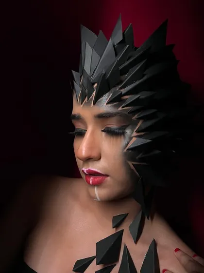This angle shows the delicate balance of the makeup, with one half of the face being more natural and the other fully integrated into the fantasy design.