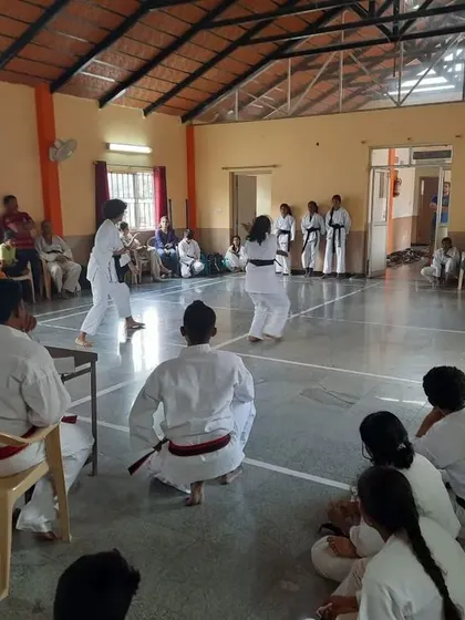 A closer look at the kumite portion of the black belt exam, where candidates must demonstrate their fighting skills.