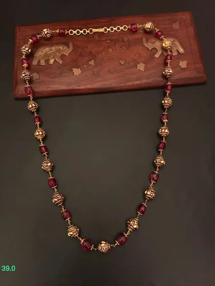 A rich maroon beaded necklace from my 92.5 silver gold-plated collection. The color is deep and luxurious, perfect for festive occasions.