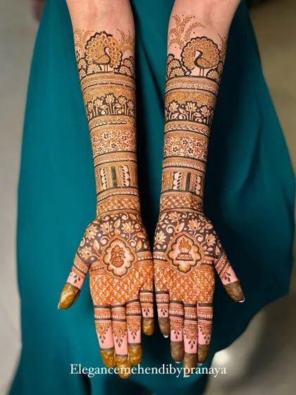 A classic full bridal mehendi design that is both grand and elegant. The symmetrical patterns feature my signature peacocks, delicate lotuses, and intricate jaal work for a timeless look.
