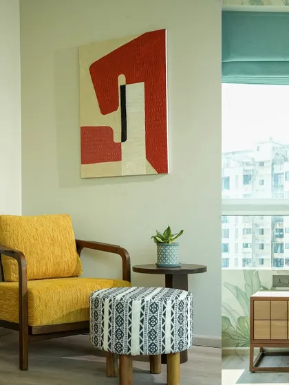 This shot captures a cozy reading corner, combining a mid-century modern yellow armchair with contemporary art and patterned textiles. I focused on the natural light from the window to create a soft, peaceful mood, perfect for showcasing a relaxing corner in a home.