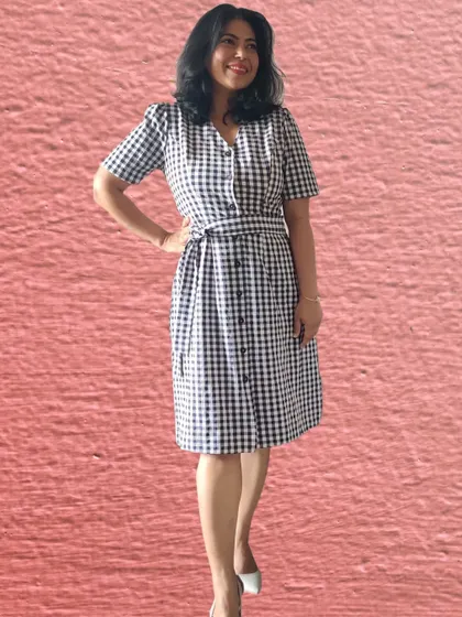 This checked dress comes with an attached belt that can be tied in a few different ways. Here is the first look, with the belt tied neatly in the front for a classic, defined waist.