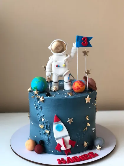 Another view of the detailed astronaut and space-themed cake.