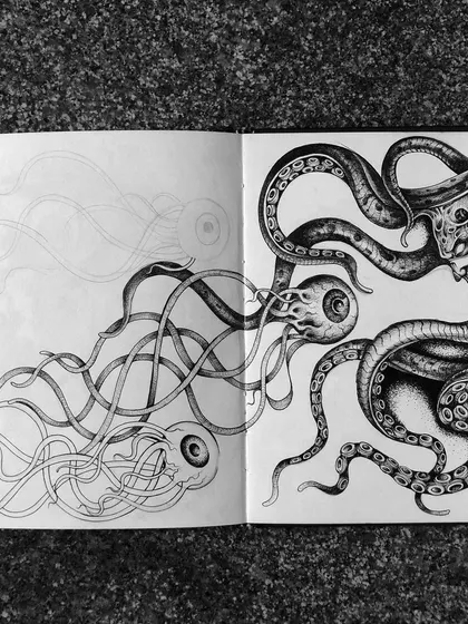 A sketchbook spread showing the octopus creature.