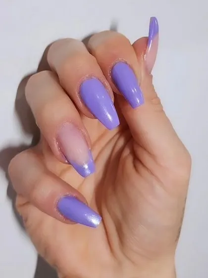 A dreamy lavender shade on long, coffin-shaped nails with a sheer accent. A beautiful and modern way to wear pastels.