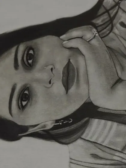 A close-up, angled shot of the finished portrait, highlighting the detailed shading around the eyes and mouth.