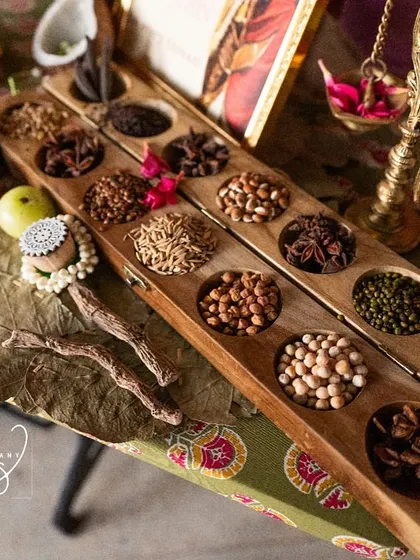 Another shot of the legacy counter, highlighting the rich textures of the silk sarees and the traditional grains.