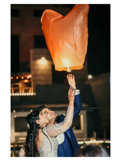 A hopeful and symbolic moment as the couple releases a sky lantern together. This beautifully lit night shot captures their shared wishes for the future.