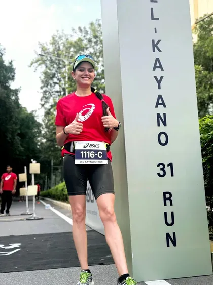 A runner gives a thumbs up next to the 'Gel Kayano 31 Run' sign. We celebrate new gear and the innovations that help us run better.